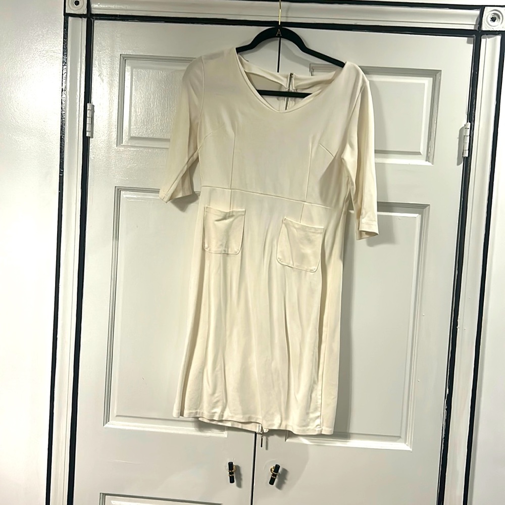 Cream three quarter sleeve dress with front pockets